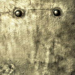 Grunge gray metal plate with rivets screws background texture