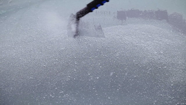 Man Scraping a Frozen Car Windshield With Audio