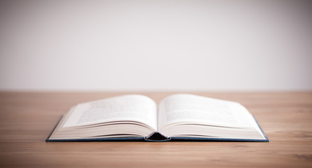 Open book on wooden deck