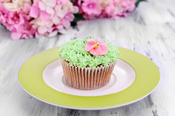 Tasty cupcake with butter cream,