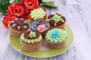 Tasty cupcakes with butter cream,