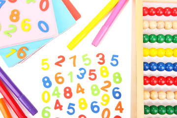 Colorful numbers, abacus, books and markers, isolated on white