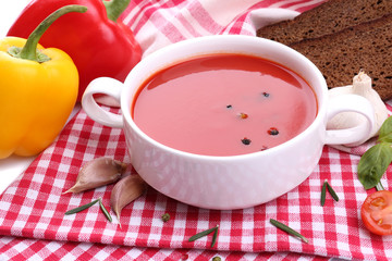 Tasty tomato soup and vegetables, close up
