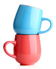 Blue and pink cups isolated on white