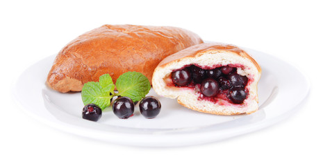 Fresh baked pasties with currant isolated on white