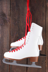 Figure skates on wooden background