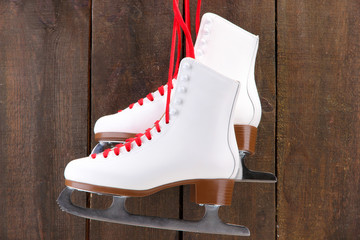 Figure skates on wooden background
