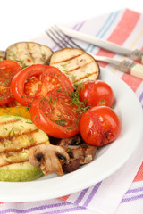Delicious grilled vegetables on plate on table close-up