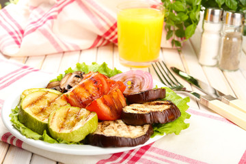 Delicious grilled vegetables on plate on table close-up