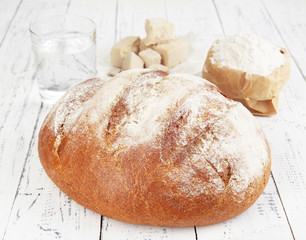 Composition with rye bread on wooden background