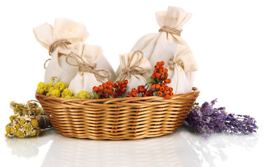 Textile sachet pouches with dried flowers, herbs  and berries