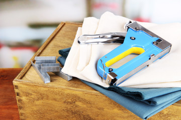 Construction stapler with fabrics and staples
