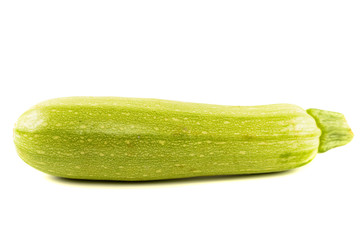 Single Courgette or zucchini from low perspective isolated on wh