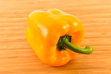 Yellow Bell Pepper on wood