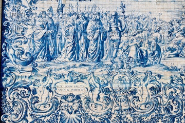 Fototapeta na wymiar Painted tiles azulejos on the wall of a church in Porto