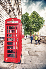 Fototapeta na wymiar Iconic red telephone boxes in the streets of London