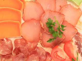 Various meat slices and parsley.