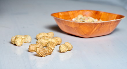 Peanuts in a brown bowl