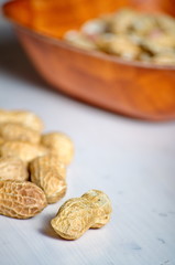 Peanuts in a brown bowl