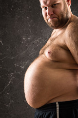 Fat man looking at camera cropped view