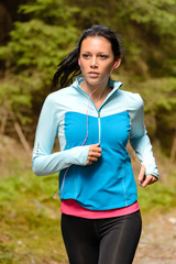 Running woman with headphones outdoor