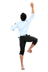 Portrait of businessman climb the wall