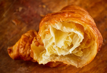 A delicious croissant on the wooden table