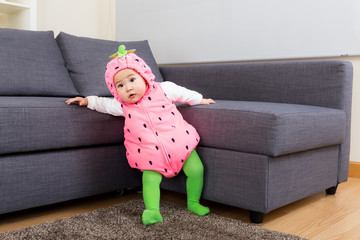 Baby girl with strawberry costume