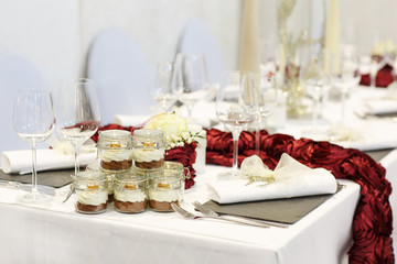 Elegant table set in soft creme for wedding or event party.