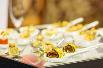 Different tasty snacks on luxury banquet table