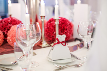 Elegant table set  for wedding or event party in soft red and pi