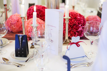 Elegant table set  for wedding or event party in soft red and pi