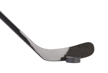 Black ice hockey stick and puck.