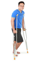male with broken foot using crutch