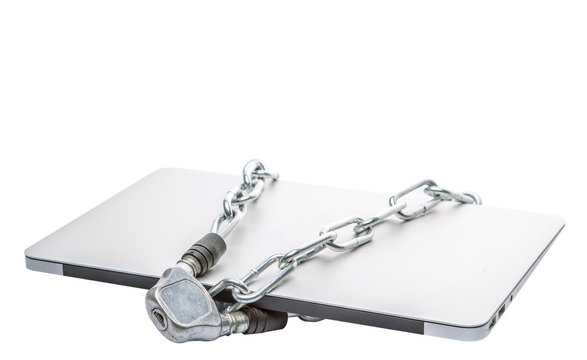 Laptop and chains over white background for PC security