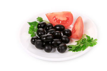 Black olives with tomatoes and parsley.