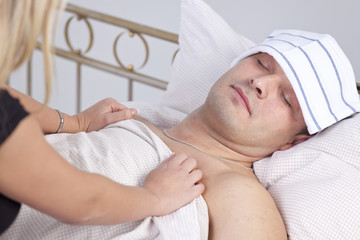 woman caring for sick man