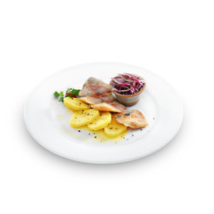 Healthy salted herring with baked potatoes, onion and fennel is