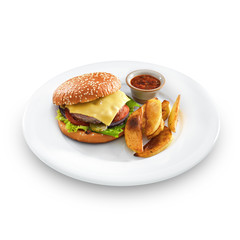 Fresh tasty hamburger with fried potatoes and salsa dip on a rou