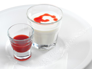 Smooth and creamy panna cotta with strawberry and raspberry sauc