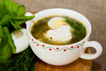Soup with sorrel, nettles and egg