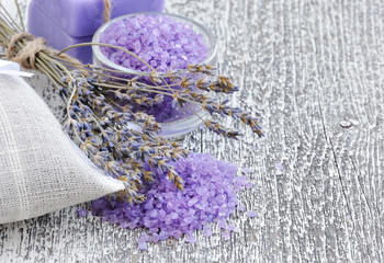 Bath salt for aromatherapy and dried lavender on an old wooden