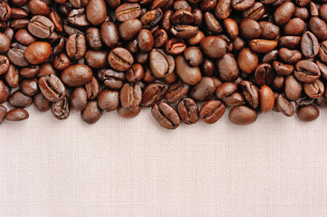 Coffee beans on linen background