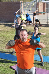 Confident Man and Group Exercising