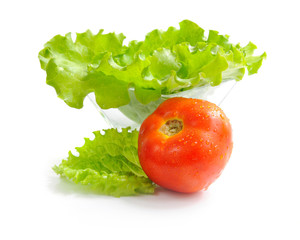 Fresh green salad and tomato isolated on white background