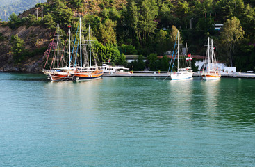 Yachts at the pier on Mediterranean turkish resort, Fethiye, Tur