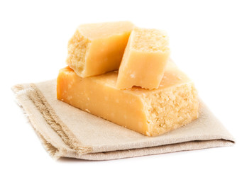 Parmesan Cheese  Isolated on White Background close up. Piece of