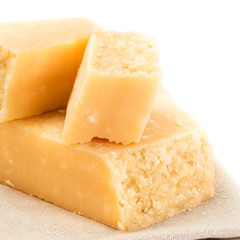 Parmesan Cheese  Isolated on White Background close up. Piece of