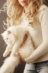Girl holding white Persian cat