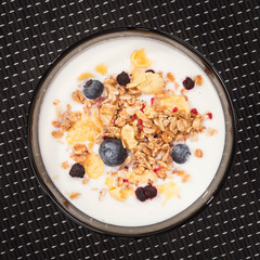 Muesli with yogurt and fresh blueberries. Top view